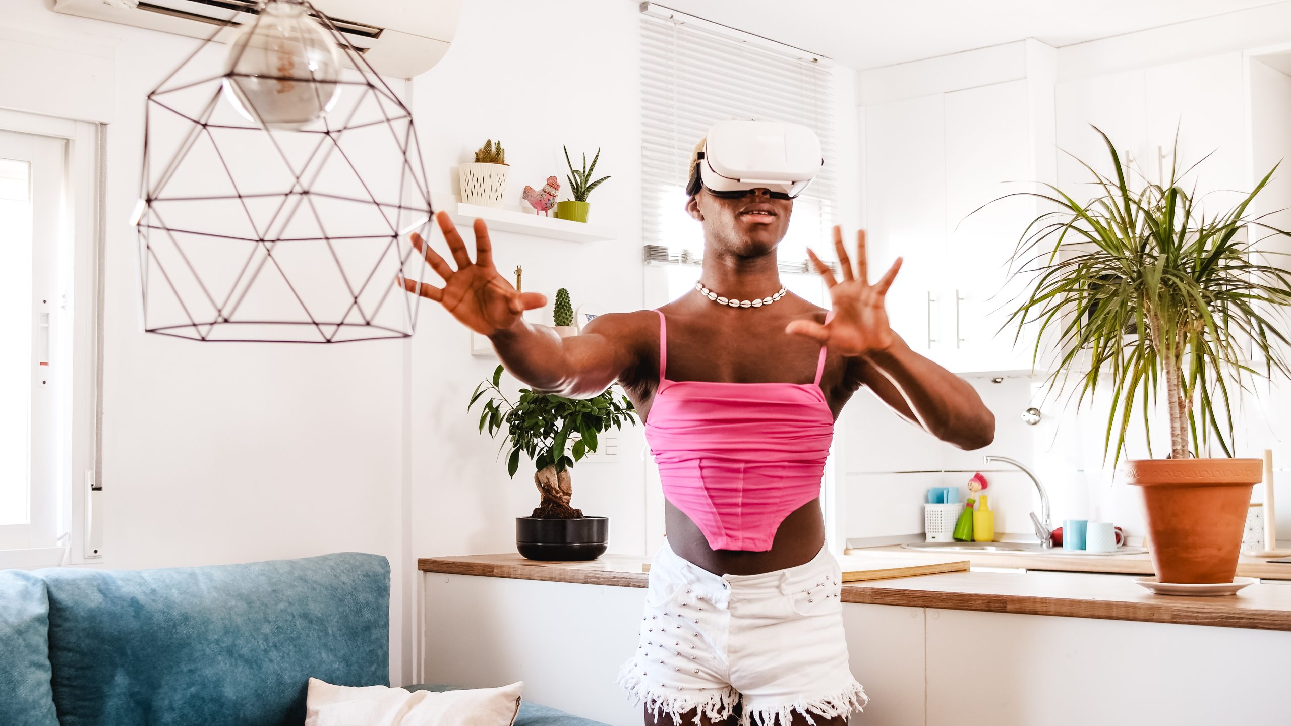 Non binary gamer person exploring virtual reality in living room at home