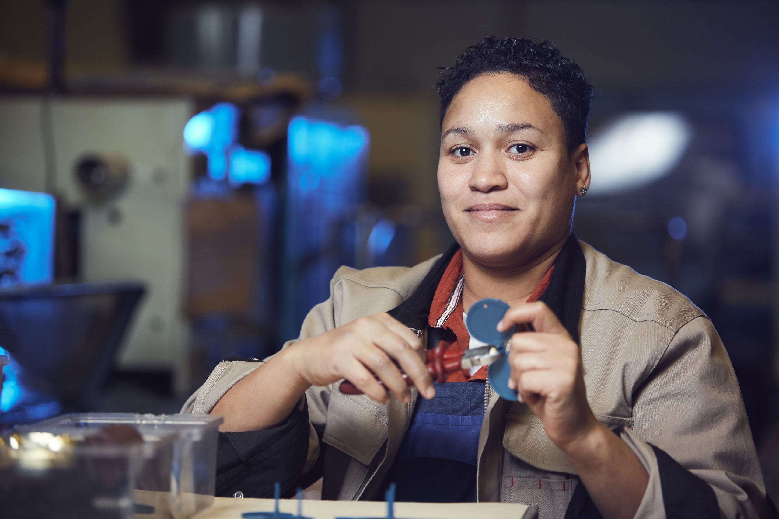 Smiling Female Worker at Production Line